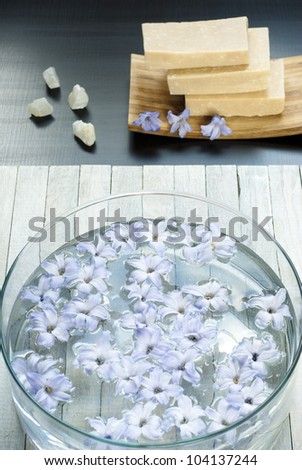 natural soaps, hyacinth flowers in aromatherapy bowl and minerals on wooden table
