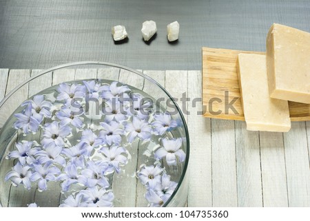 natural soaps, hyacinth flowers in aromatherapy bowl and minerals on wooden table