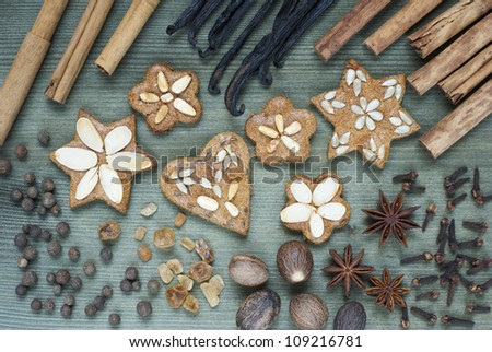 gingerbread cakes and dessert spices, wooden table background