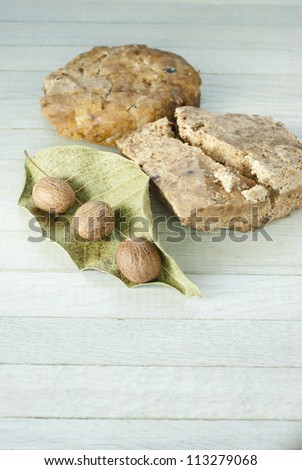 handmade african black soap and ingredients, shea butter nuts, dried leaves