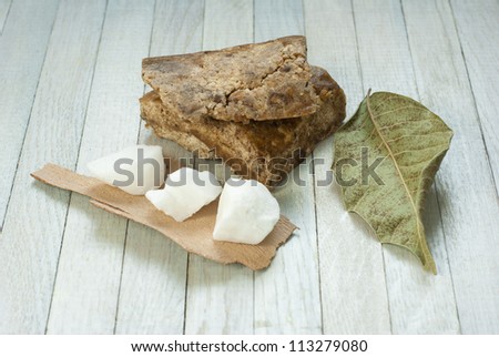 handmade african black soap and ingredients, dried  leaves and white shea butter