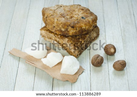 handmade african black soap and ingredients, shea butter nuts, and white shea butter