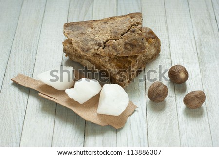 handmade african black soap and ingredients, shea butter nuts and white shea butter