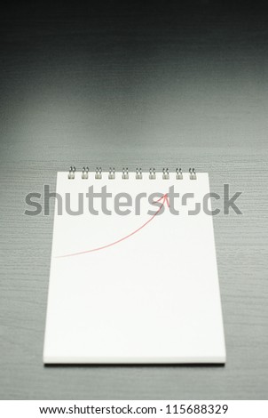 note book with growing graph
