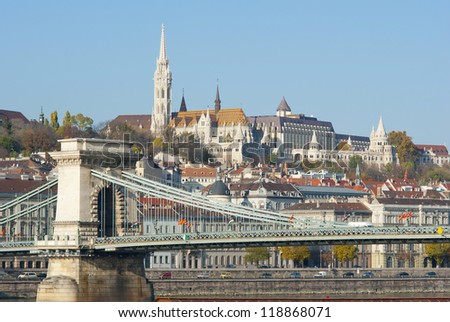 Fisherman\'s bastion and Matthias church on top of the hill, Chain bridge in foreground, Budapest, Hungary
