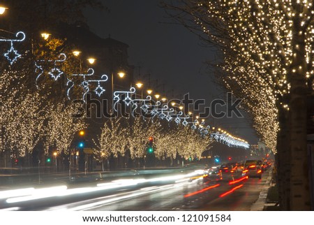 christmas decoration light bulb garlands on a row of trees, Andrassy road, Budapest, Hungary
