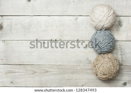 balls of wool on wooden table background, directly above