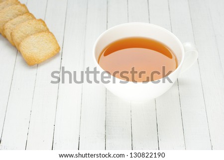 afternoon tea and butter cookies on white wood table background