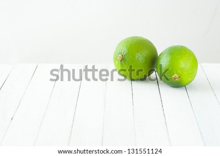 limes on white table