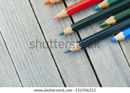 color pencils on wood table directly above