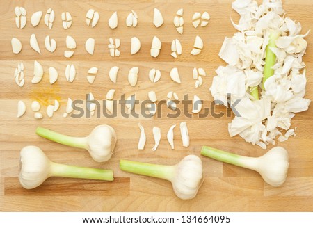 sliced garlics, wooden table, directly above