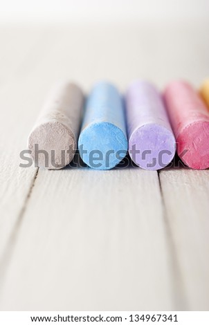 chalks on white wooden table