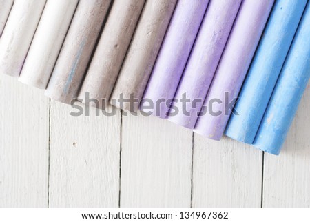 chalks on white wooden table directly above