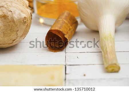 herbs and spices on white wood table