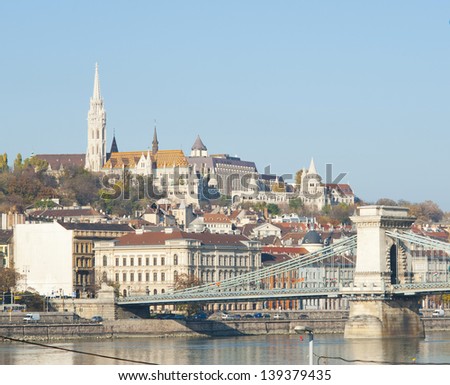 Fisherman\'s bastion and Matthias church on top of the hill, Chain bridge in foreground, Budapest, Hungary