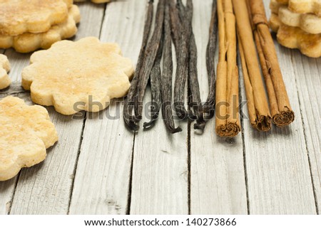 homemade gingerbread cookies with dessert spices on rustic wooden table