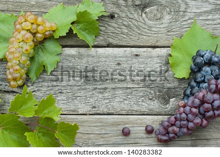 autumnal fruits frame, wooden background