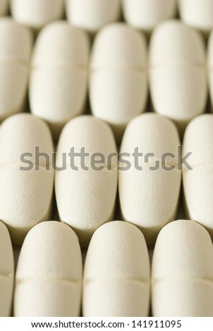 vitamin pills in a row