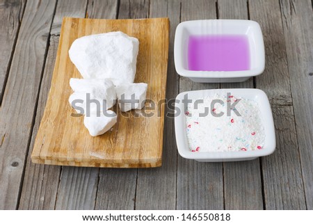 traditional and modern textile washing chemicals on wooden surface
