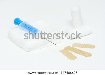 hypodermic needle and accessories, white background