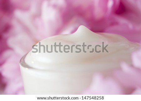 natural facial cream with beauty japanese cherry blossoms on wood