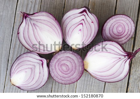 Half Cut Spanish Onions On Old Wood Table