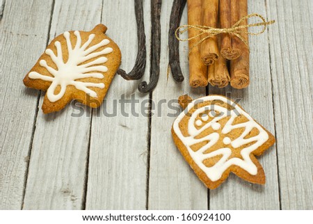 homemade gingerbread cookies with dessert spices on rustic wooden table