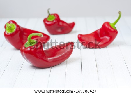 red pepper fruits on white wood table