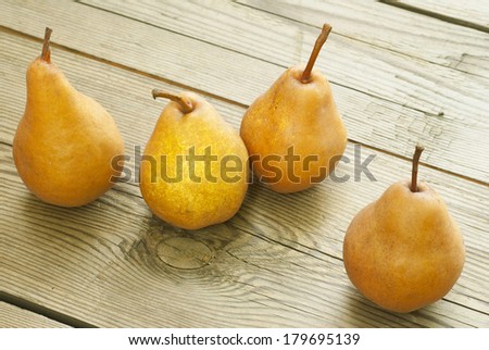 fresh pears on old wooden table