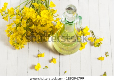 rapeseed oil with rape flowers