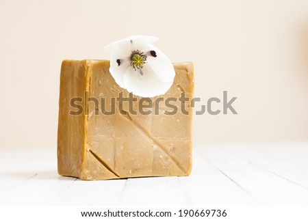 organic soap block with white poppy flower