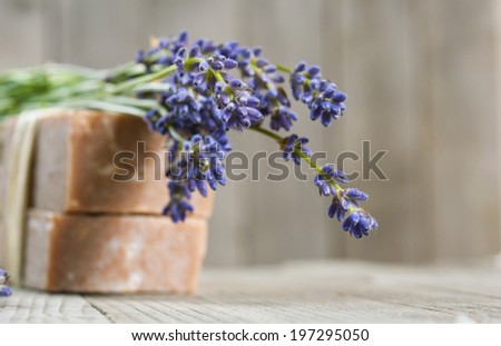 lavender soaps on old wood background