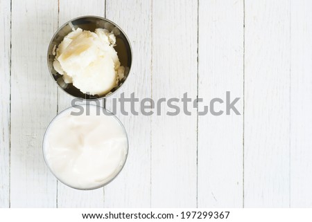 shea butter natural moisturizer and cosmetic cream on white wooden