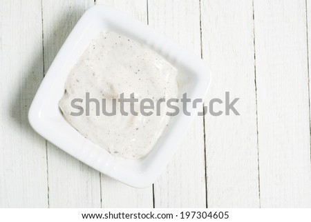 face cream  on white wooden background directly above