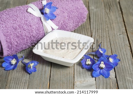 facial cleanser on wooden background