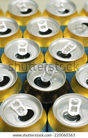 many same and one different opened beer can