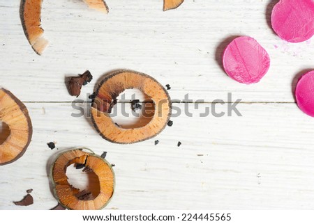 makeup accessories on white wood table