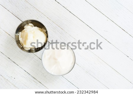 shea butter and moisturizer on white wooden