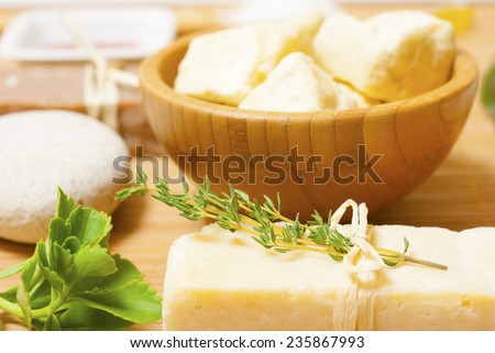 soap and shea butter on bamboo background