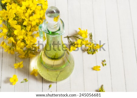 rapeseed oil with rape flowers