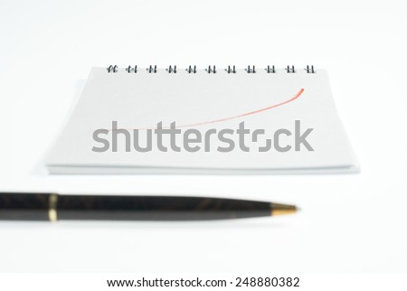 note book with growing graph on white