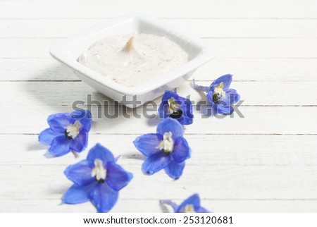 facial cleanser on wooden background