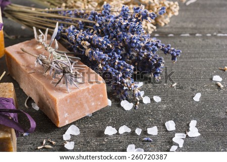 organic soaps with blue and white lavender bouquets on dark wooden table
