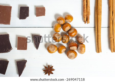 dessert spices in a row on white wooden table background