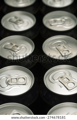 black canned drinks in dark