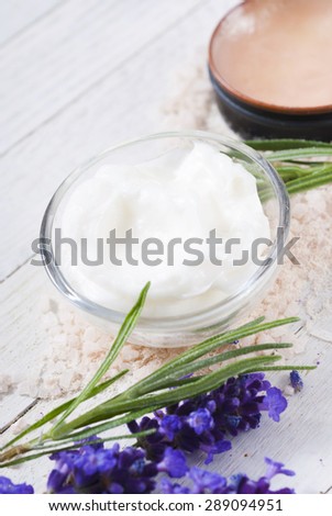 cosmetic cream and lavender on white wood table background