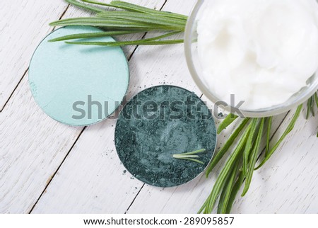 beauty product samples and lavender on white wooden table background