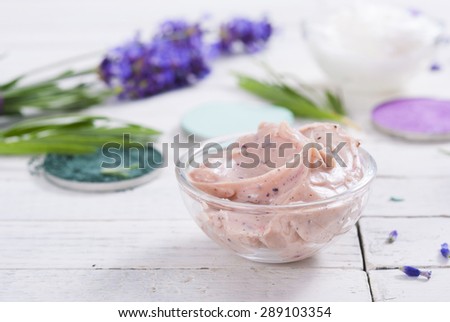 grooming products and fresh lavender bouquet on white wooden table background