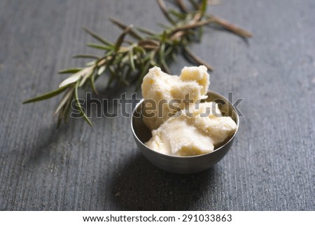 shea butter on dark wooden table