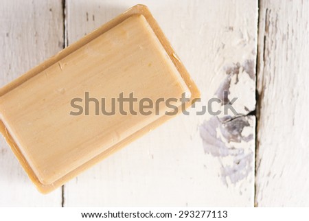 organic soap on old bright wood background